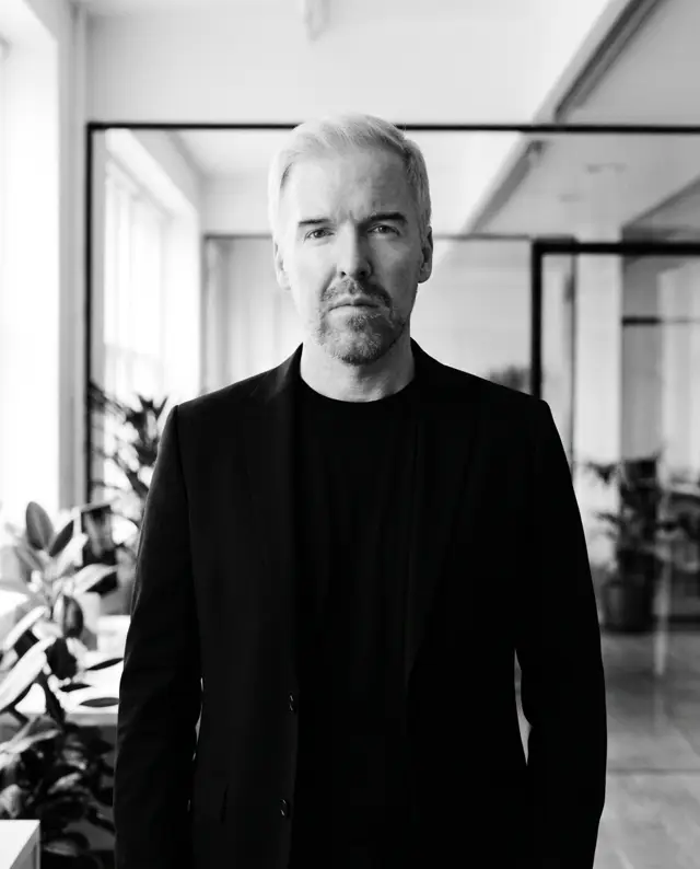 Rami Alame, chief business development officer of Daut Labz, silver-haired in a black jacket in a bright open-plan office.