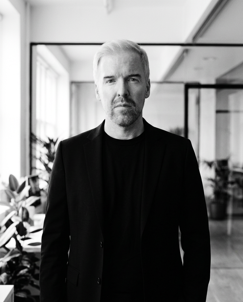 Rami Alame, chief business development officer of Daut Labz, silver-haired in a black jacket in a bright open-plan office.
